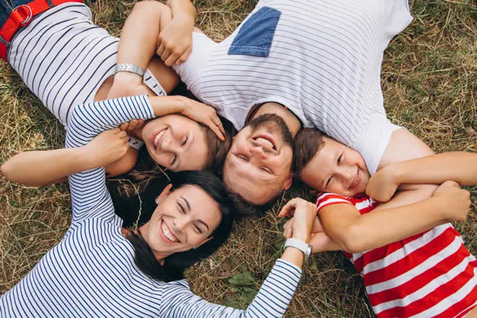 Family smiling — happy patients at Dentistry.Calm Taylor MI